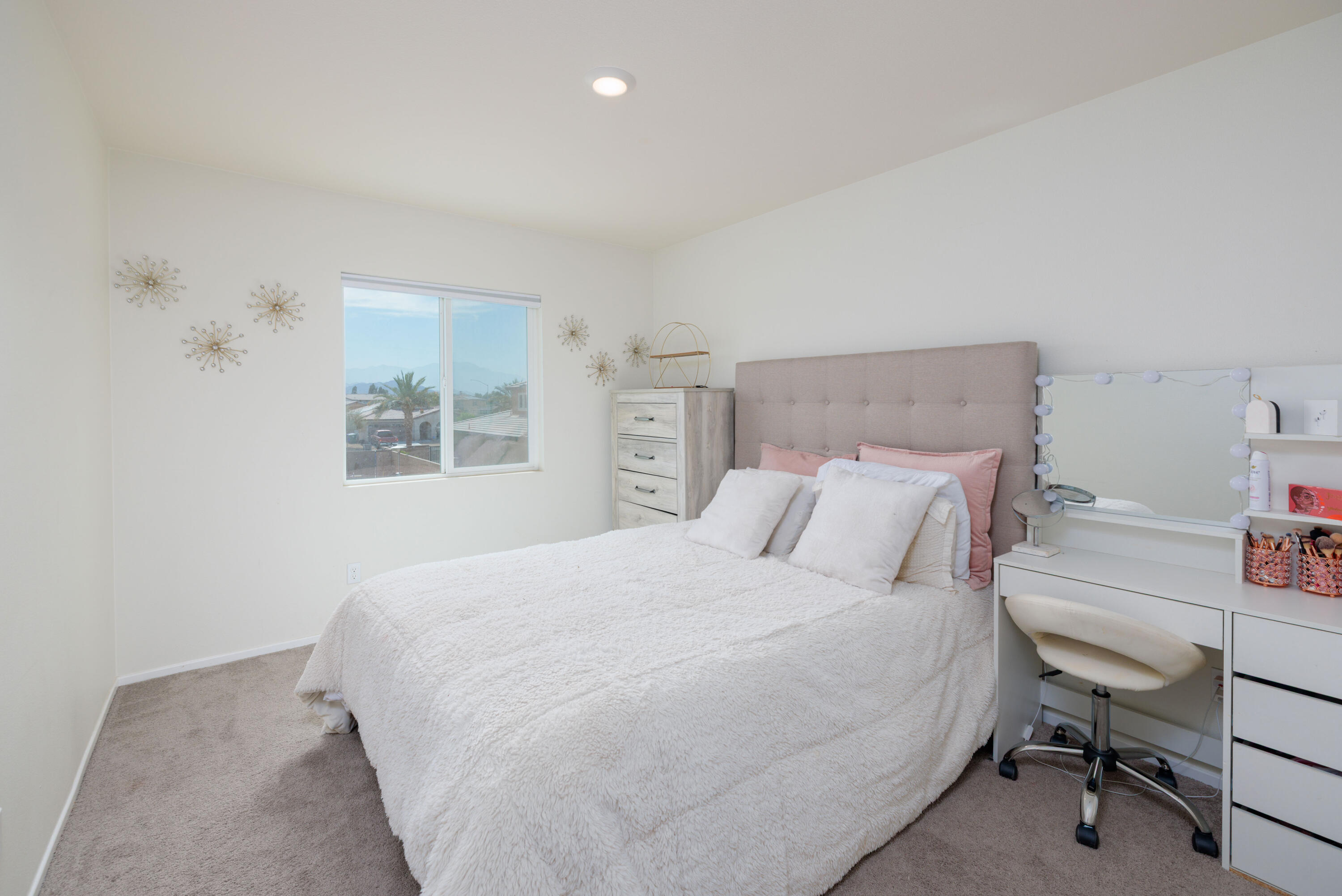 50187 Camino Rosario Coachella, CA 92236 - Photo 16 of 25 a bedroom with a bed a table and a dresser