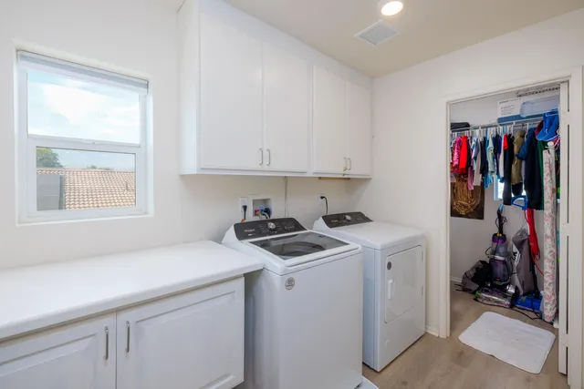 a living room with furniture and a ceiling fan