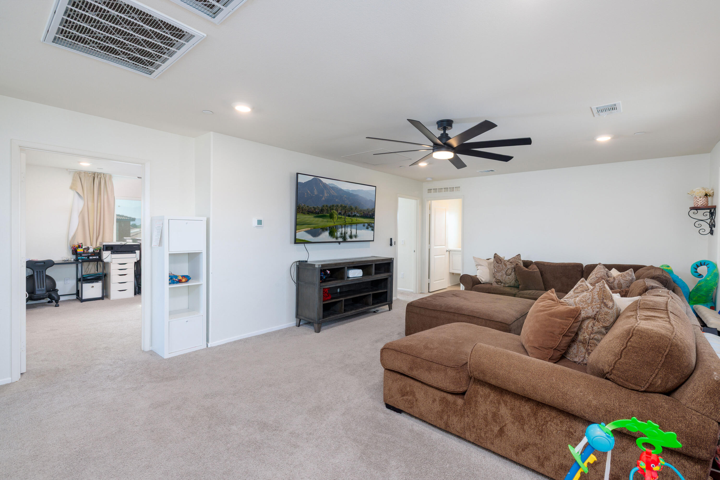 50187 Camino Rosario Coachella, CA 92236 - Photo 22 of 25 a living room with furniture and a ceiling fan