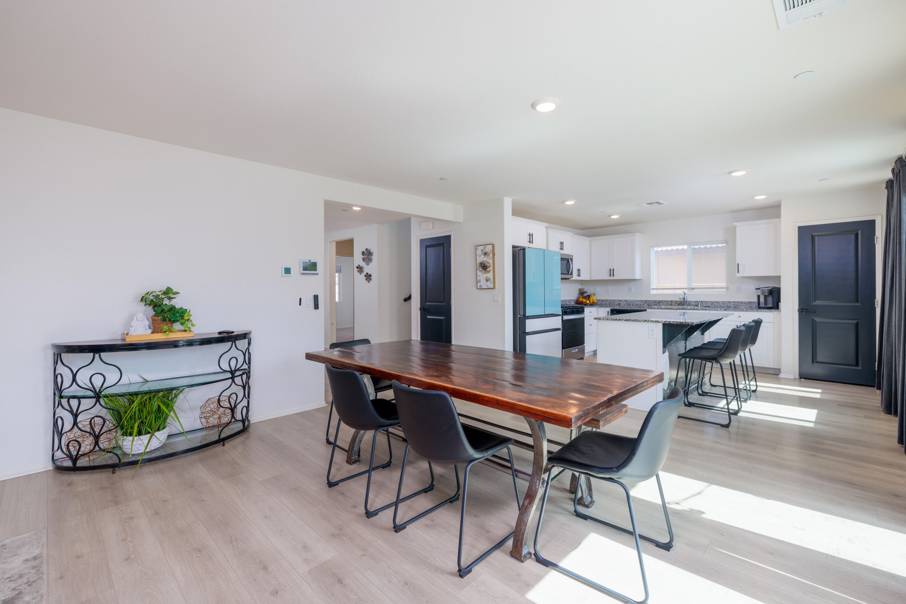 50187 Camino Rosario Coachella, CA 92236 - Photo 6 of 25 a dining room with furniture and a kitchen view