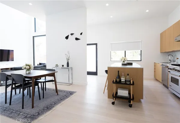 a living room with furniture a window and a table