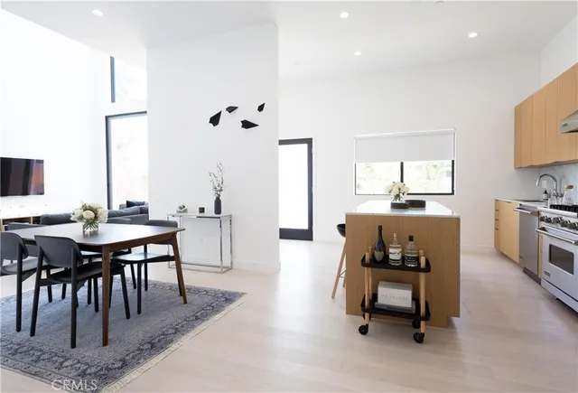 a living room with furniture a window and a table