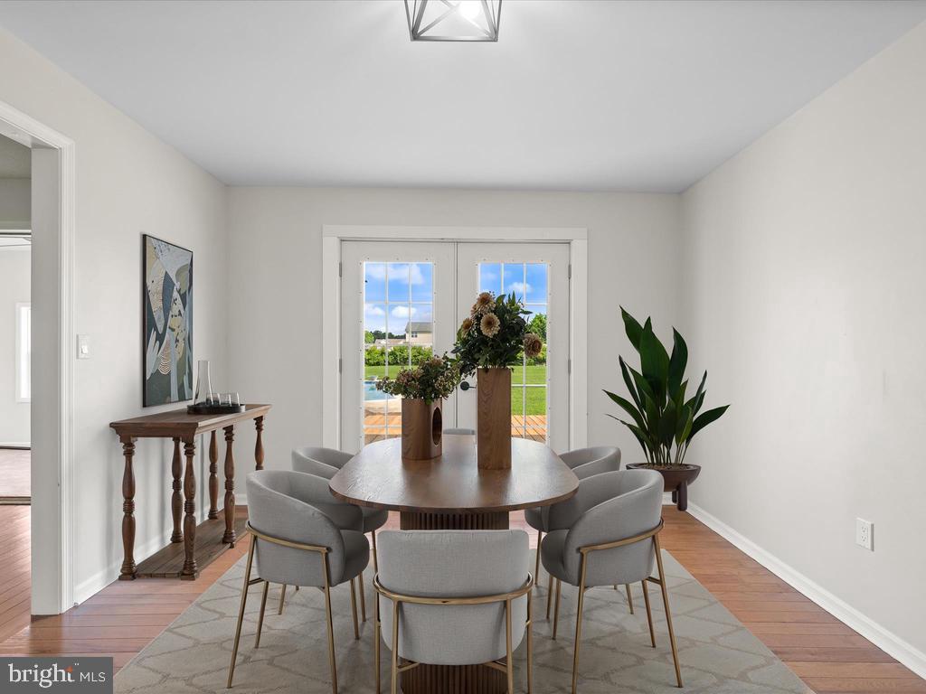 991 Church Hill Road Milford, DE 19963 - Photo 19 of 38 a dining room with furniture and wooden floor