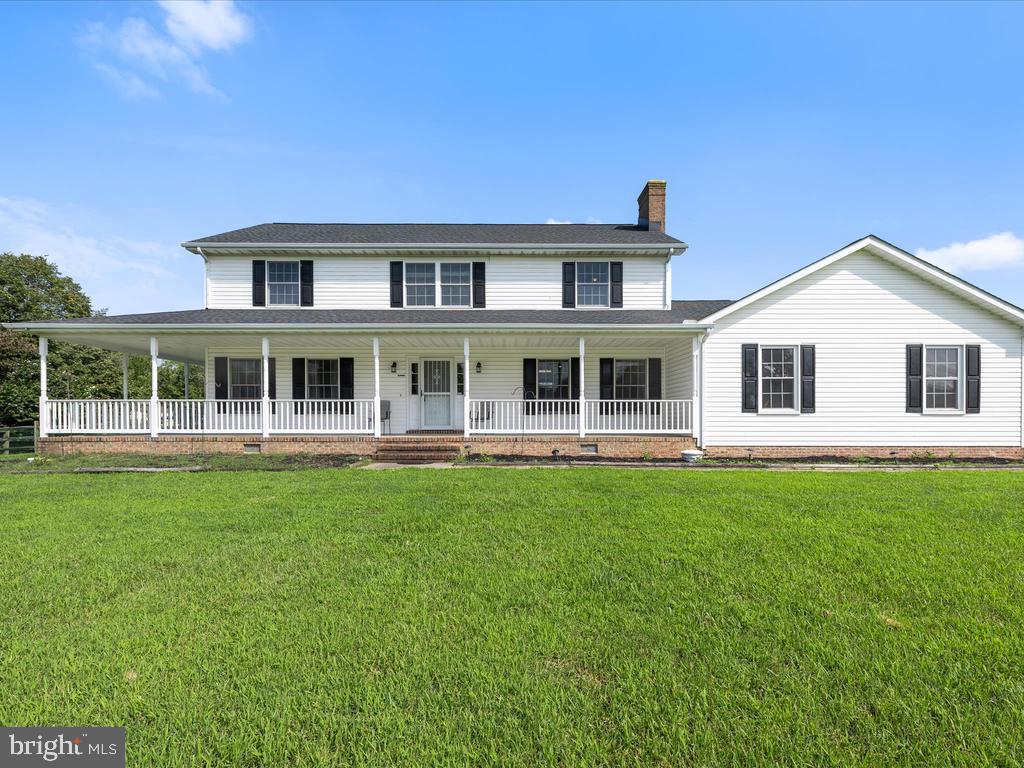 991 Church Hill Road Milford, DE 19963 - Photo 2 of 38 a front view of a house with a garden
