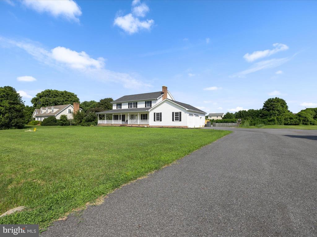 991 Church Hill Road Milford, DE 19963 - Photo 3 of 38 a front view of a house with garden