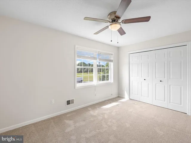 a bathroom with a granite countertop sink and a bathtub