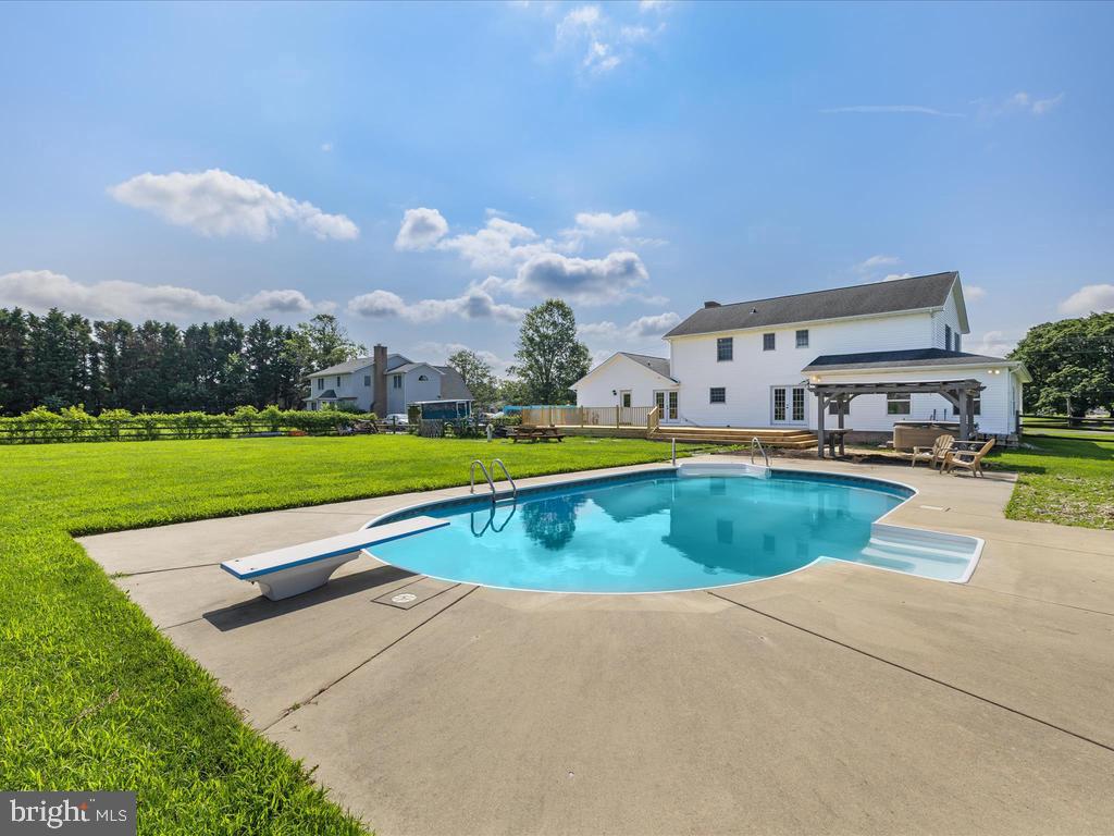 991 Church Hill Road Milford, DE 19963 - Photo 6 of 38 a view of swimming pool with outdoor seating and yard