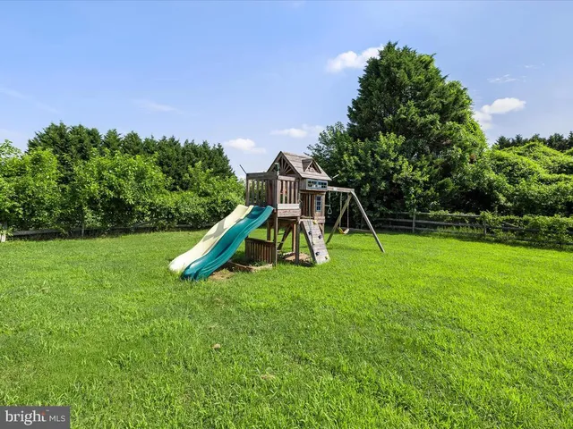a view of a park with a slide