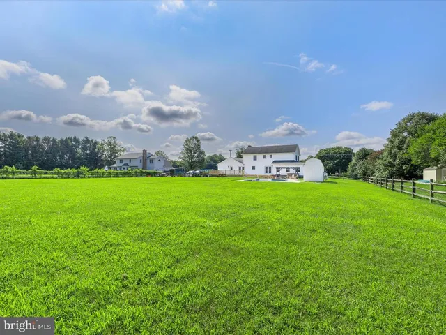 a kitchen with sink cabinets and wooden floor