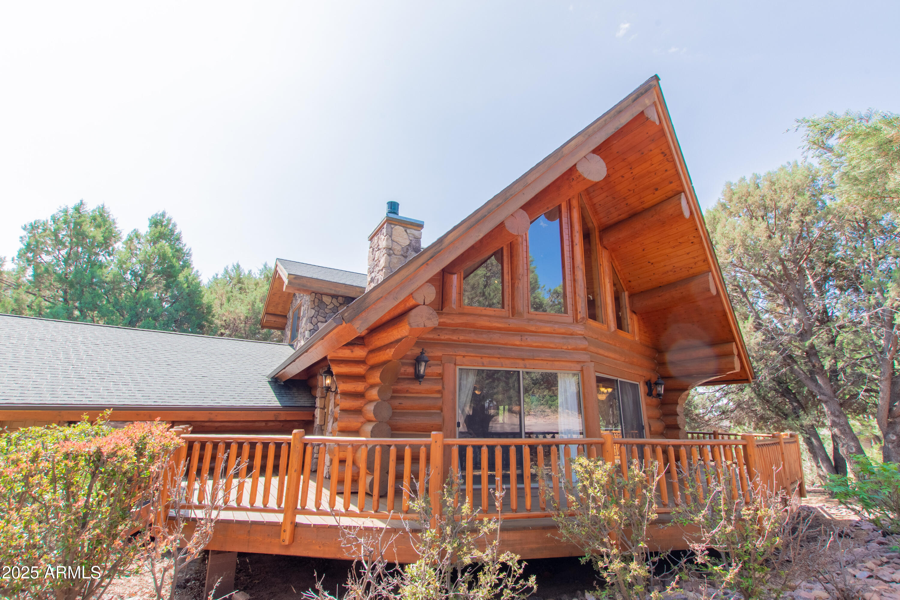 6168 Hidden Pines Loop Pine, AZ 85544 - Photo 2 of 77 a view of a house with a yard