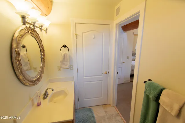 a view of a wooden balcony and trees