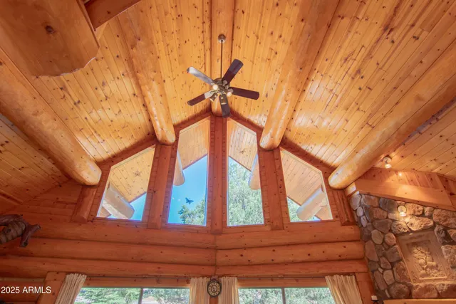 an aerial view of a house with a yard basket ball court and outdoor seating