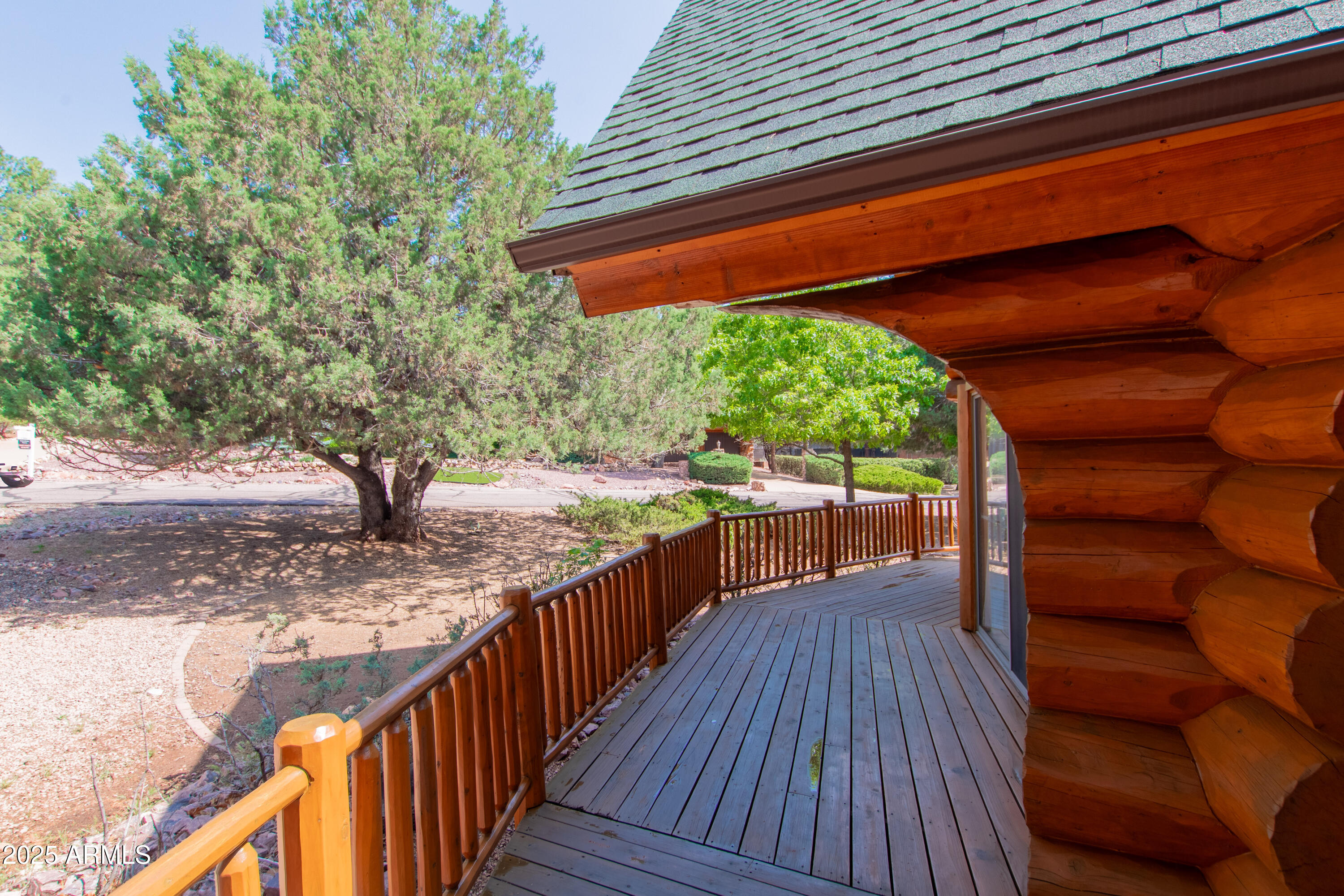 6168 Hidden Pines Loop Pine, AZ 85544 - Photo 41 of 77 a balcony with wooden floor and outdoor seating