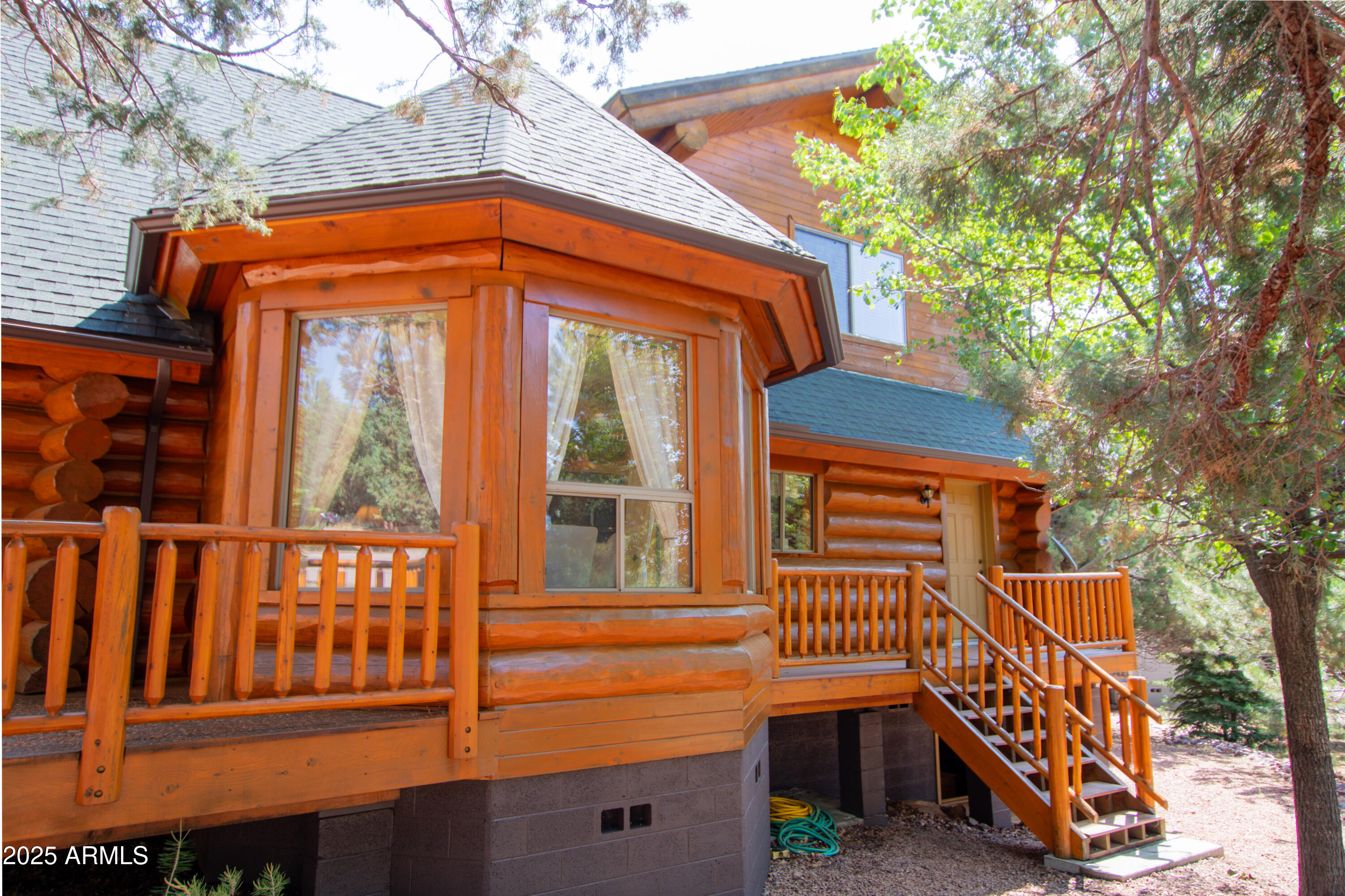 6168 Hidden Pines Loop Pine, AZ 85544 - Photo 53 of 77 a front view of a house with a yard