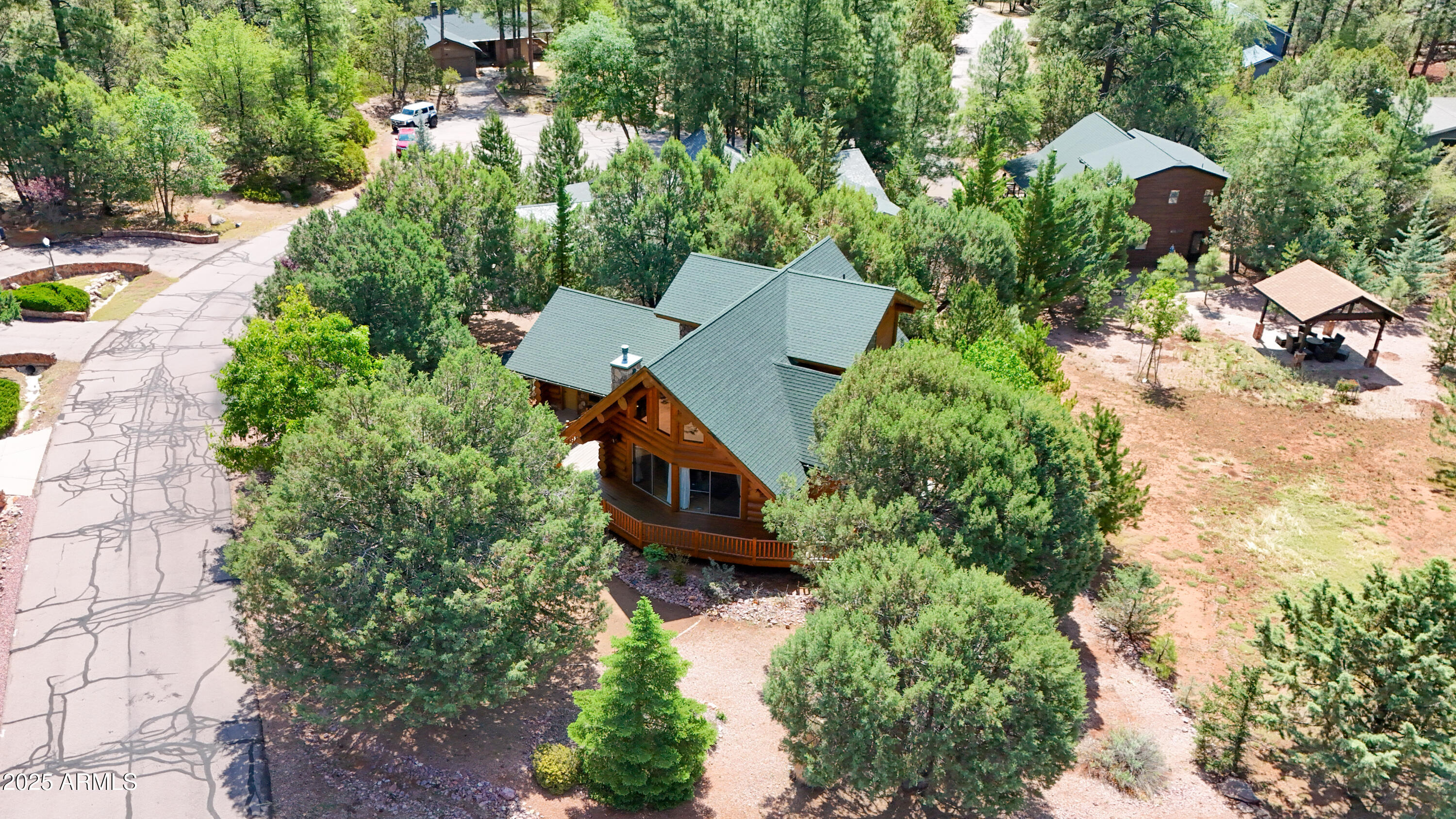 6168 Hidden Pines Loop Pine, AZ 85544 - Photo 61 of 77 an aerial view of a house with a yard basket ball court and outdoor seating