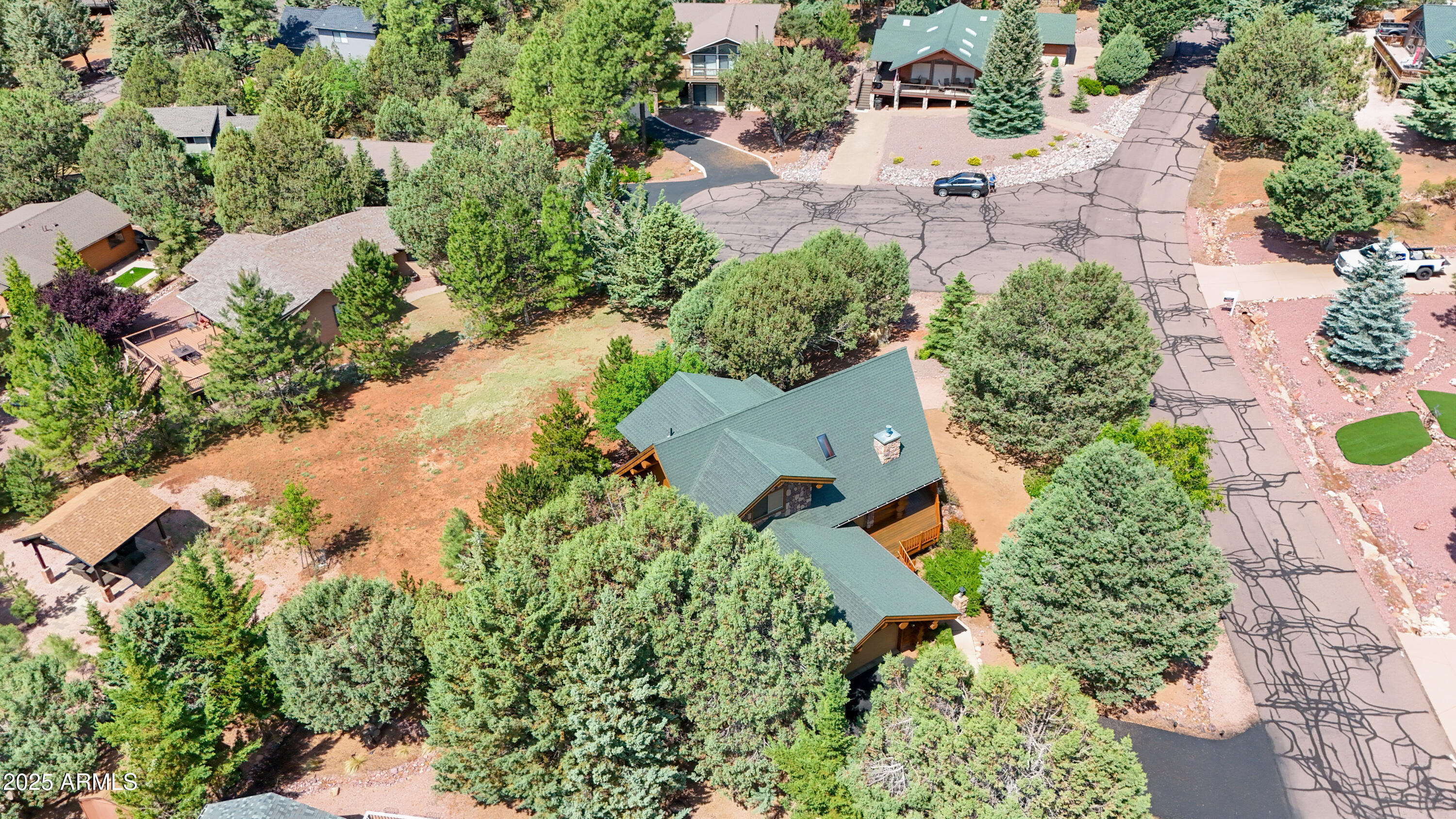 6168 Hidden Pines Loop Pine, AZ 85544 - Photo 67 of 77 an aerial view of a house with a yard