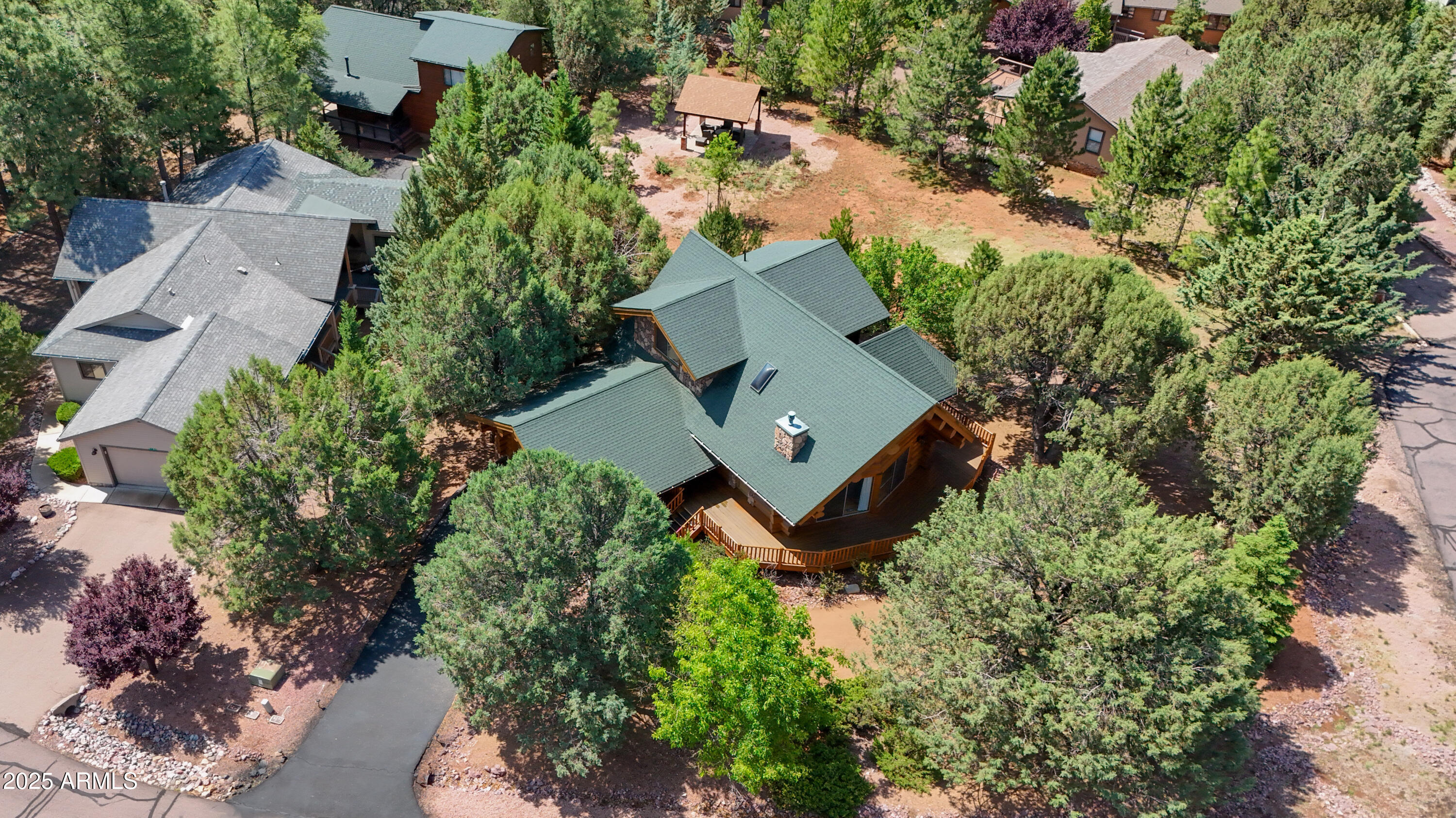 6168 Hidden Pines Loop Pine, AZ 85544 - Photo 70 of 77 an aerial view of a house with a yard