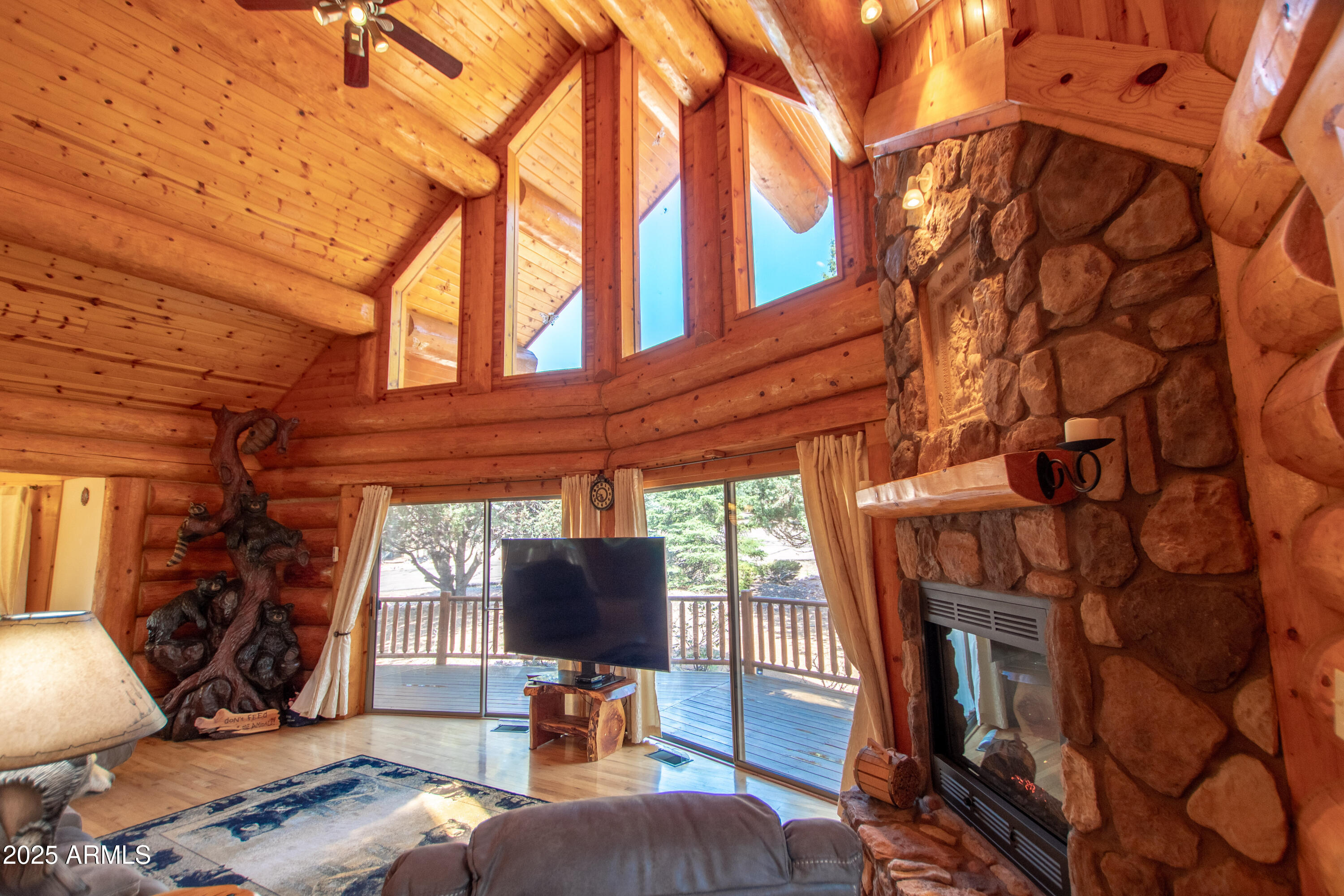 6168 Hidden Pines Loop Pine, AZ 85544 - Photo 8 of 77 a bedroom with furniture and a flat screen tv
