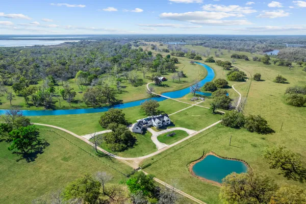 an aerial view of a house with a garden