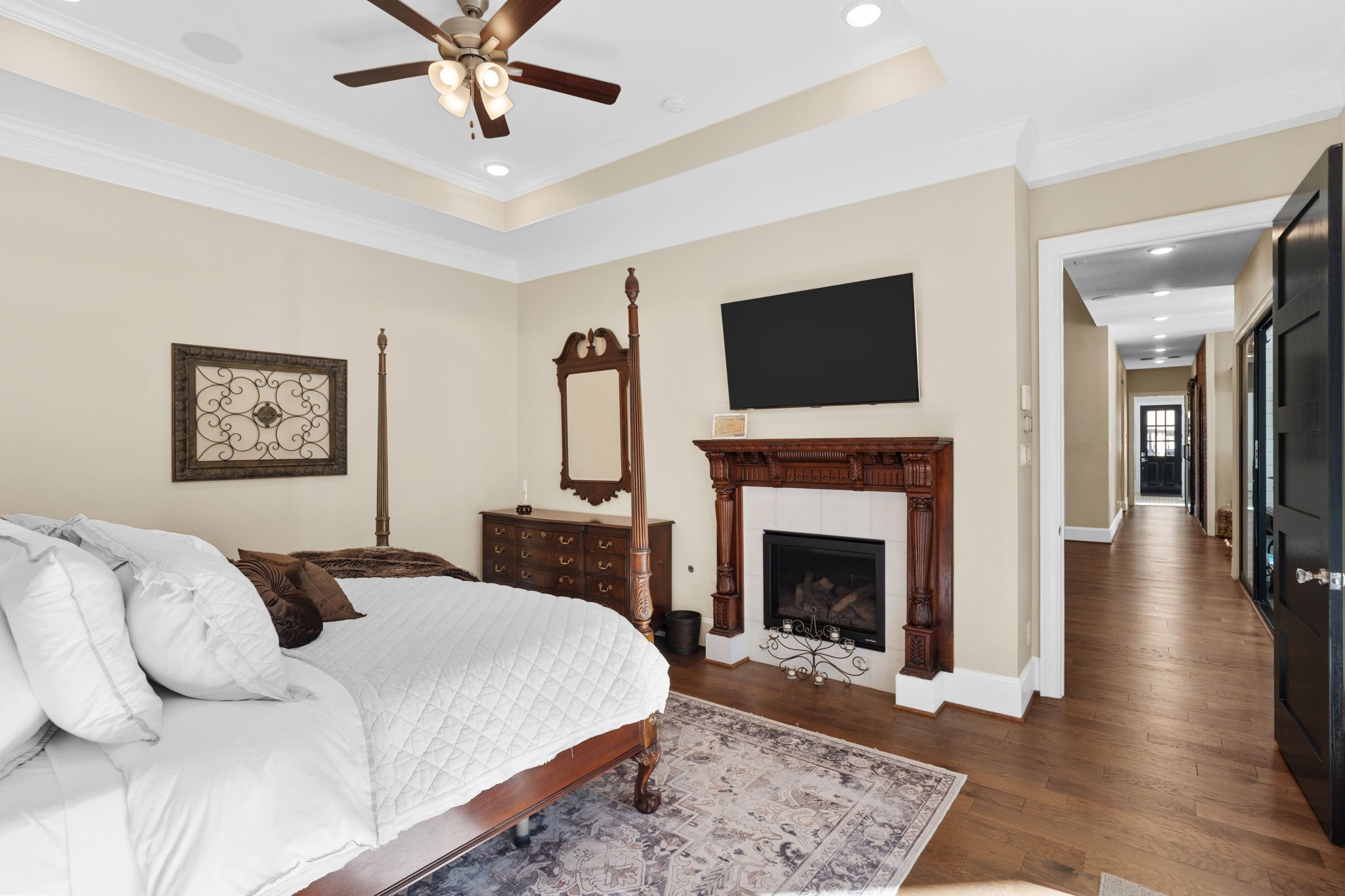 7341 County Road 27 Damon, TX 77430 - Photo 28 of 50 a bedroom with a bed and a fireplace