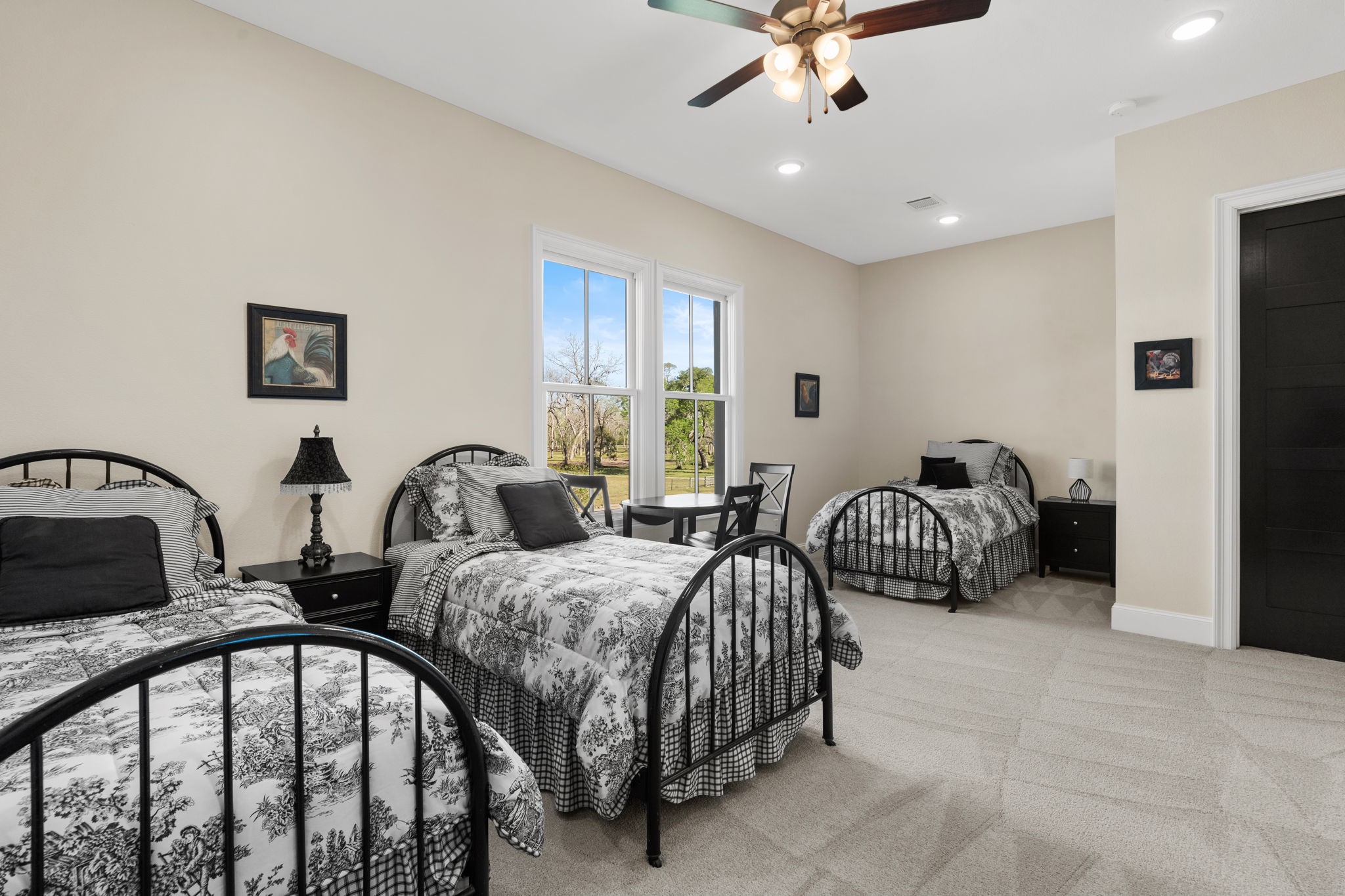 7341 County Road 27 Damon, TX 77430 - Photo 35 of 50 a bedroom with bed and a chandelier