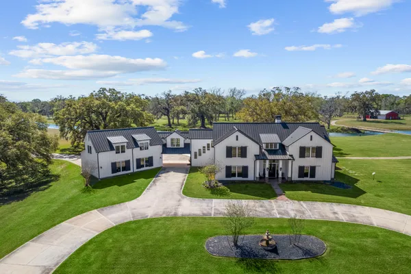 a aerial view of a house with a big yard