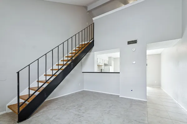 a view of an entryway with wooden floor