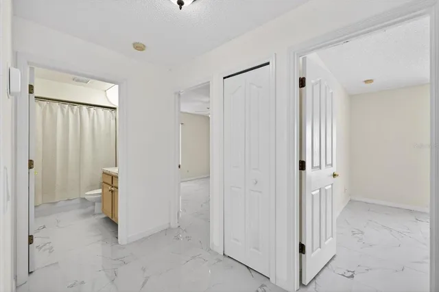 a view of a bathroom with closet area