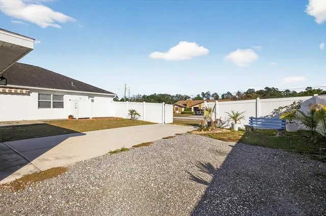 a view of a house with outdoor space and sitting area