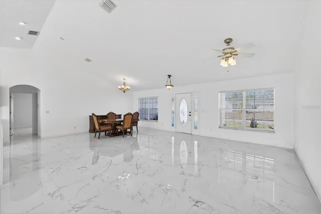 a view of livingroom with furniture and ceiling fan