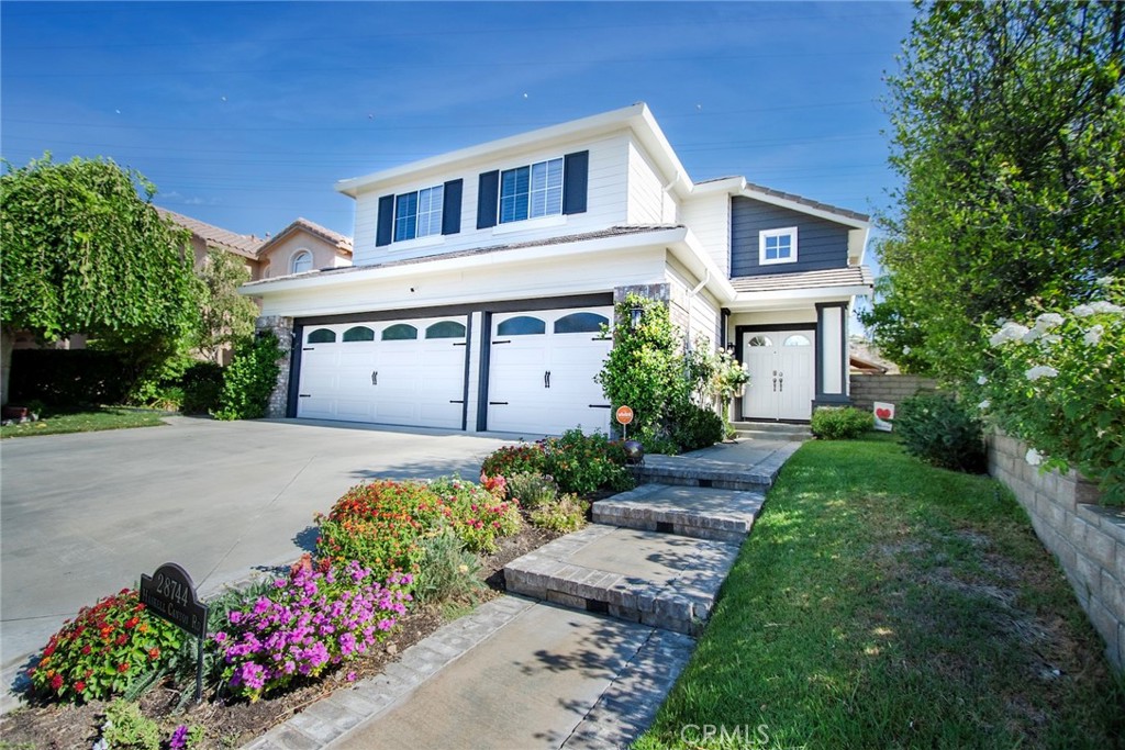 28744 Haskell Canyon Road Saugus, CA 91390 - Photo 1 of 1 a front view of a house with a yard and a fence