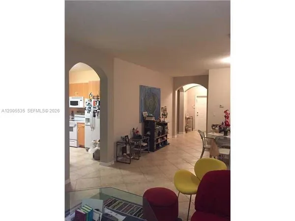 a view of living room with furniture and wooden floor