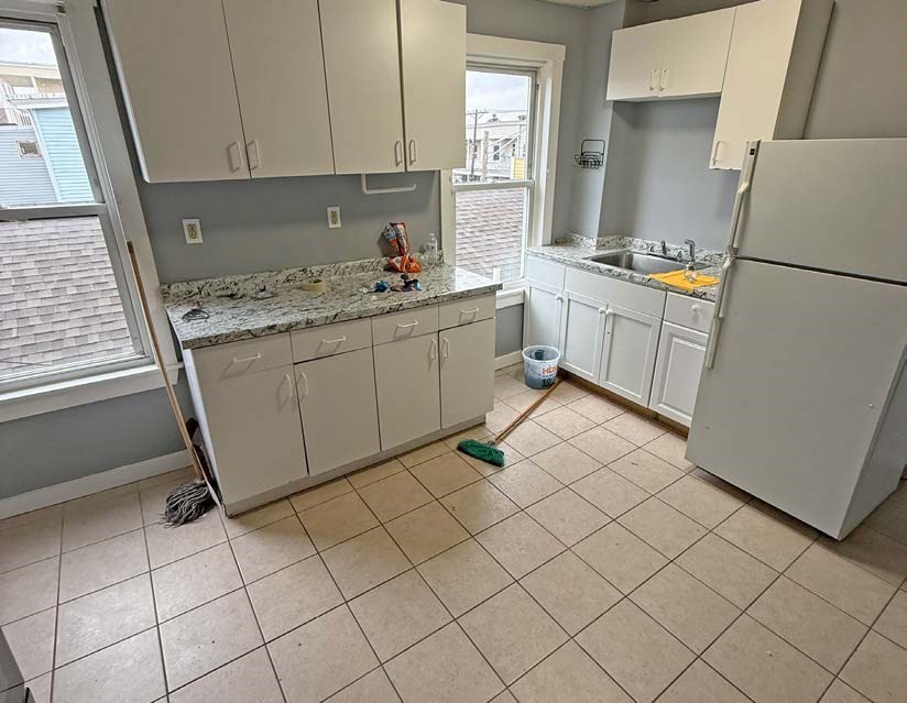 161-167 South Union Street Lawrence, MA 01843 - Photo 13 of 17 a kitchen with a cabinets and appliances