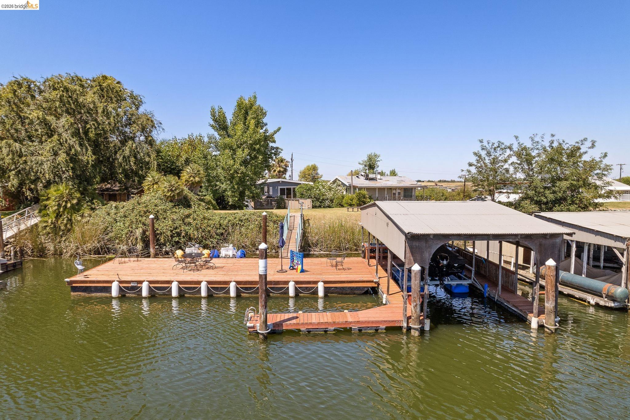 1704 Taylor Road Bethel Island, CA 94511 - Photo 3 of 73 Private dock with a covered boat slip, extended sun deck, and additional floating dock