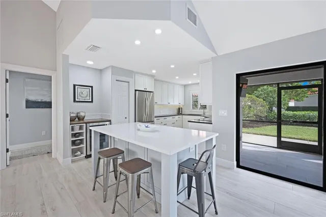 a kitchen with a table and chairs in it