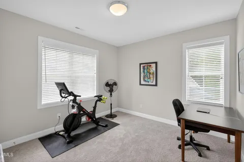 a bedroom with furniture and window