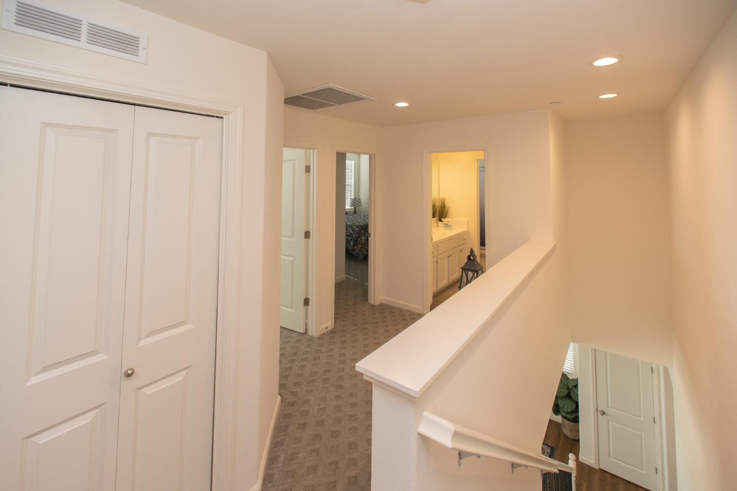 982 Moran Road West Madera, CA 93636 - Photo 6 of 9 a view of hallway with stairs and wooden floor