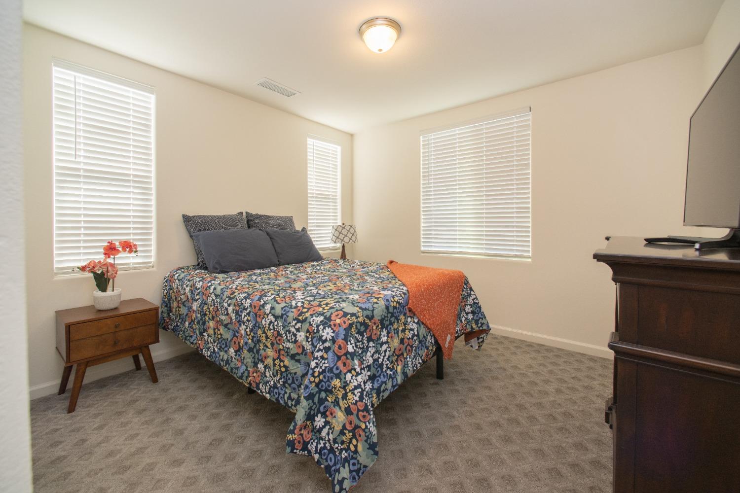 982 Moran Road West Madera, CA 93636 - Photo 9 of 9 a bedroom with a bed and a window