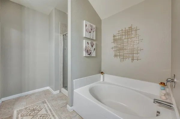a white bath tub sitting next to a window