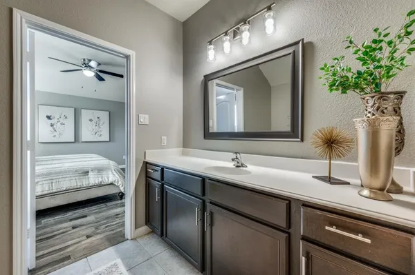a en suite bathroom with double sink and a mirror