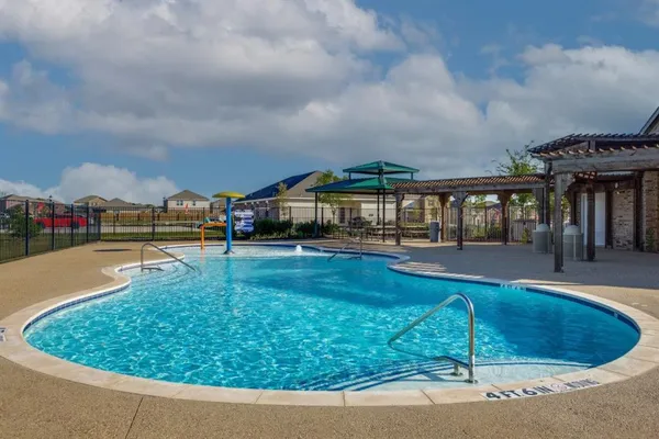 a view of swimming pool with outdoor seating
