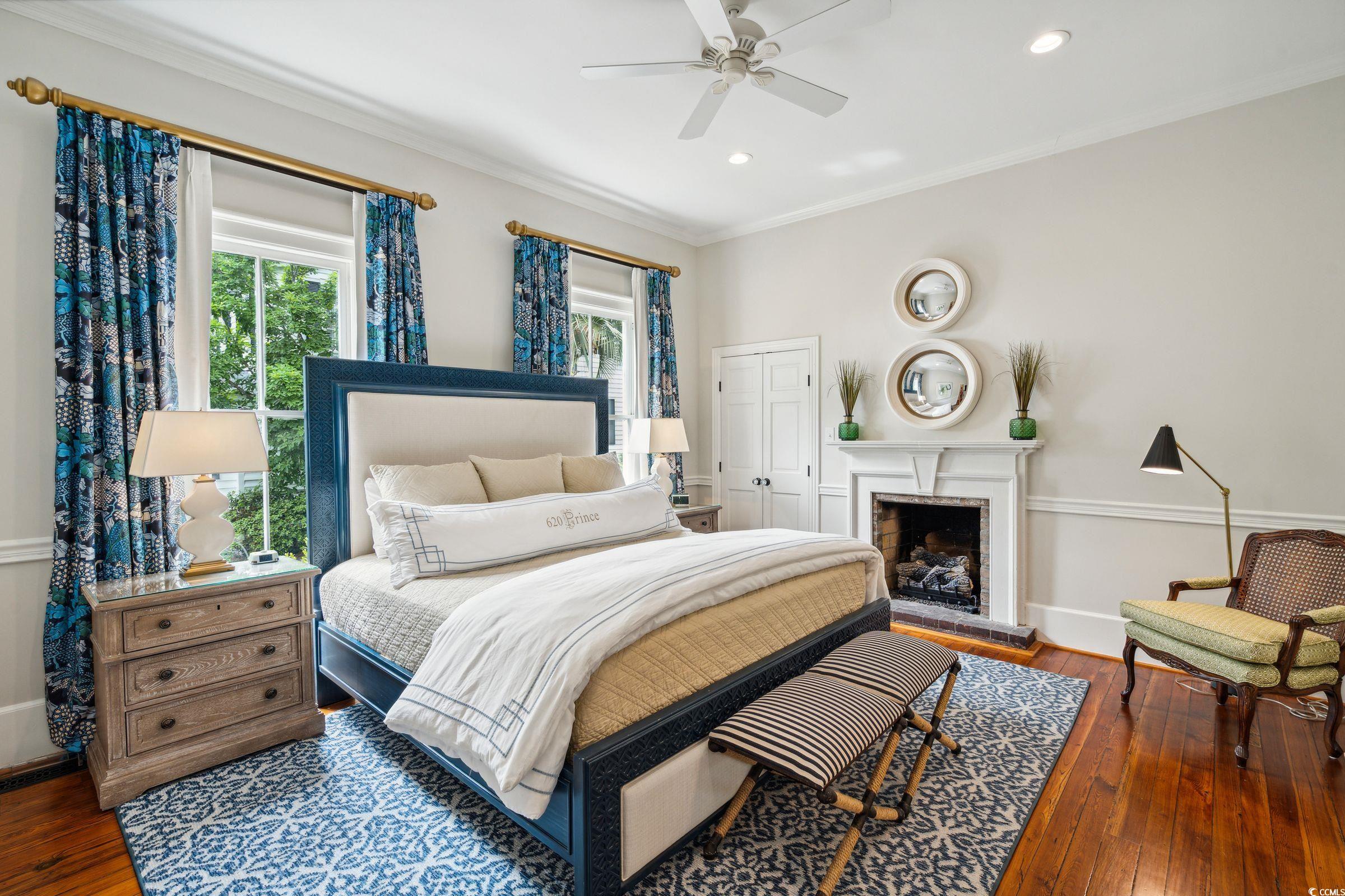 620 Prince Street Georgetown, SC 29440 - Photo 17 of 40 Bedroom featuring a closet, crown molding, hardwoo