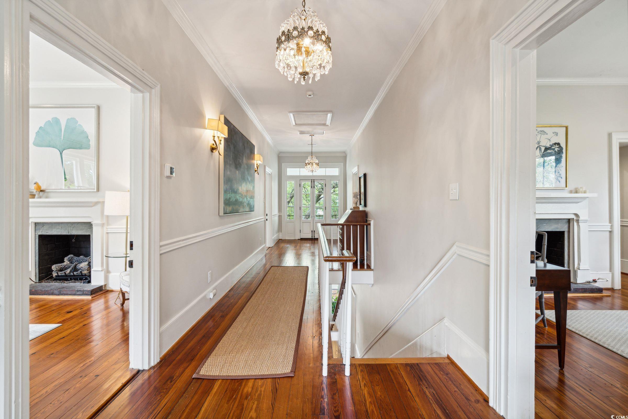 620 Prince Street Georgetown, SC 29440 - Photo 20 of 40 Corridor with ornamental molding and wood-type flo