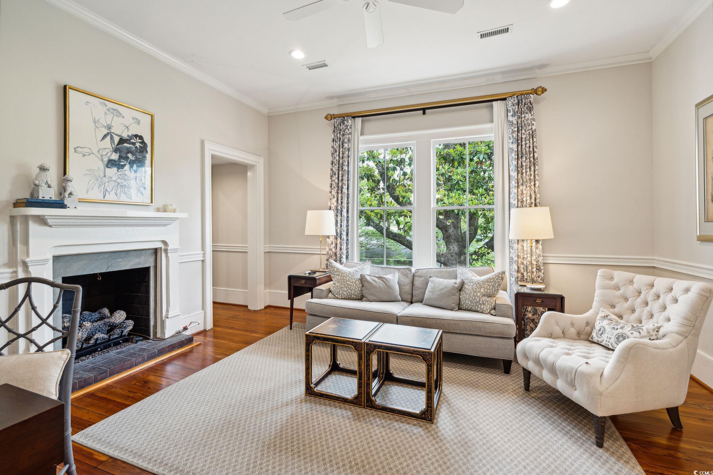 620 Prince Street Georgetown, SC 29440 - Photo 23 of 40 Living room featuring ceiling fan, a fireplace, ha