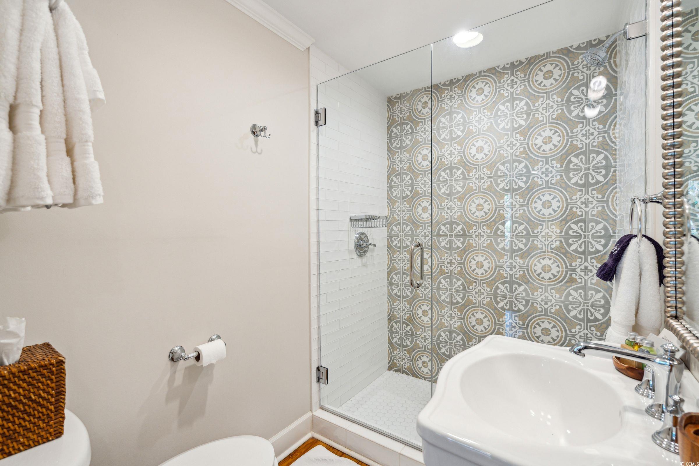620 Prince Street Georgetown, SC 29440 - Photo 36 of 40 Bathroom featuring a shower with shower door, sink