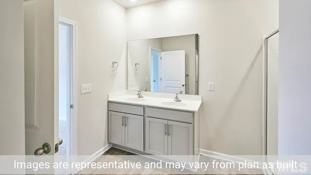 a bathroom with a sink a vanity and a mirror