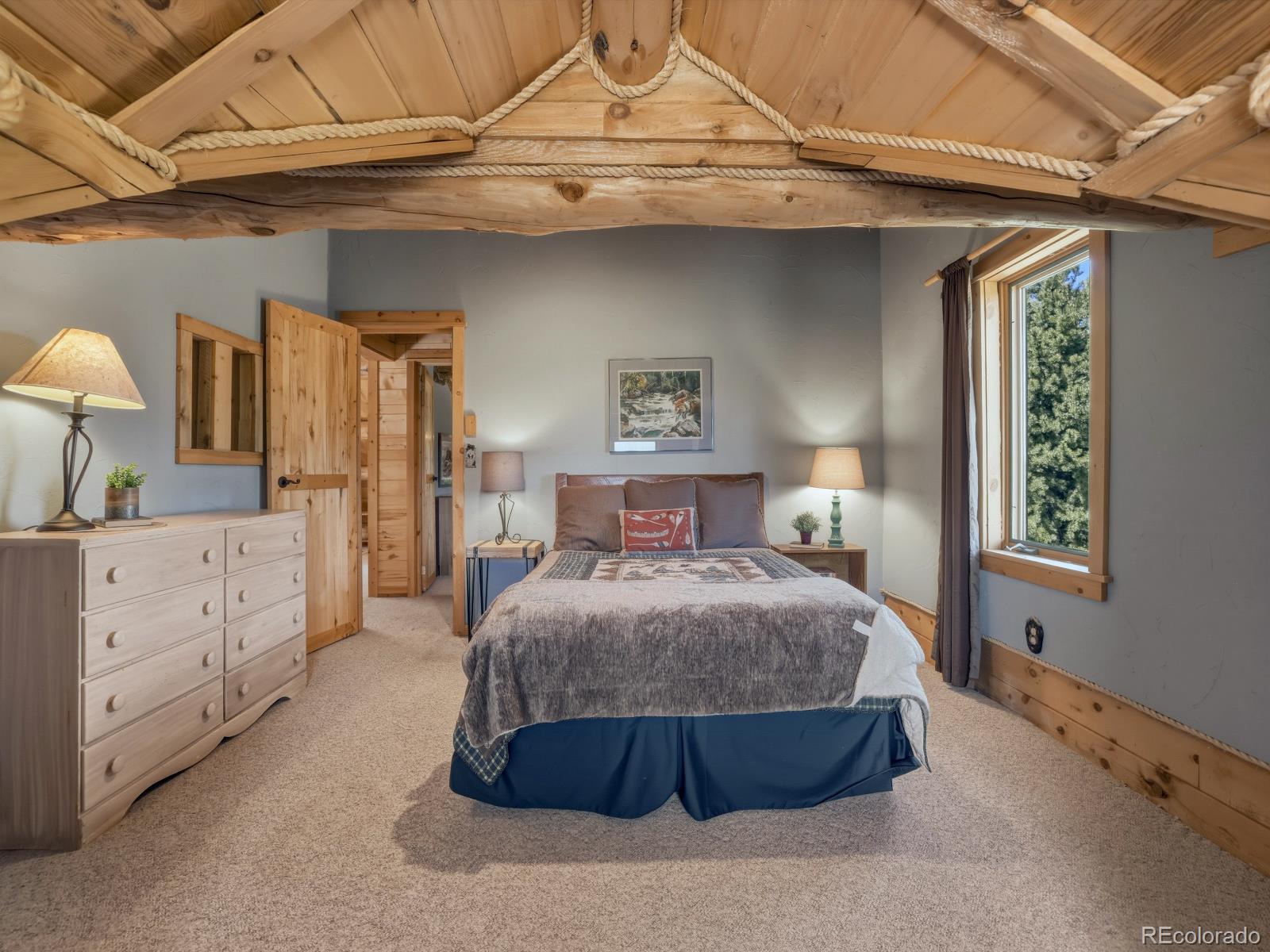 341 Anderson Road Walden, CO 80480 - Photo 36 of 50 a spacious bedroom with a bed and a dresser