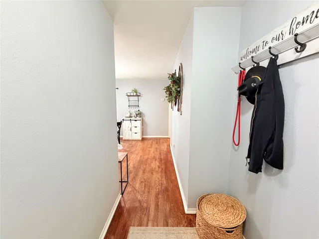 a view of a dining room with furniture and window
