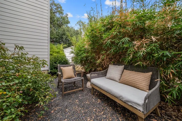 a view of a bench in the backyard