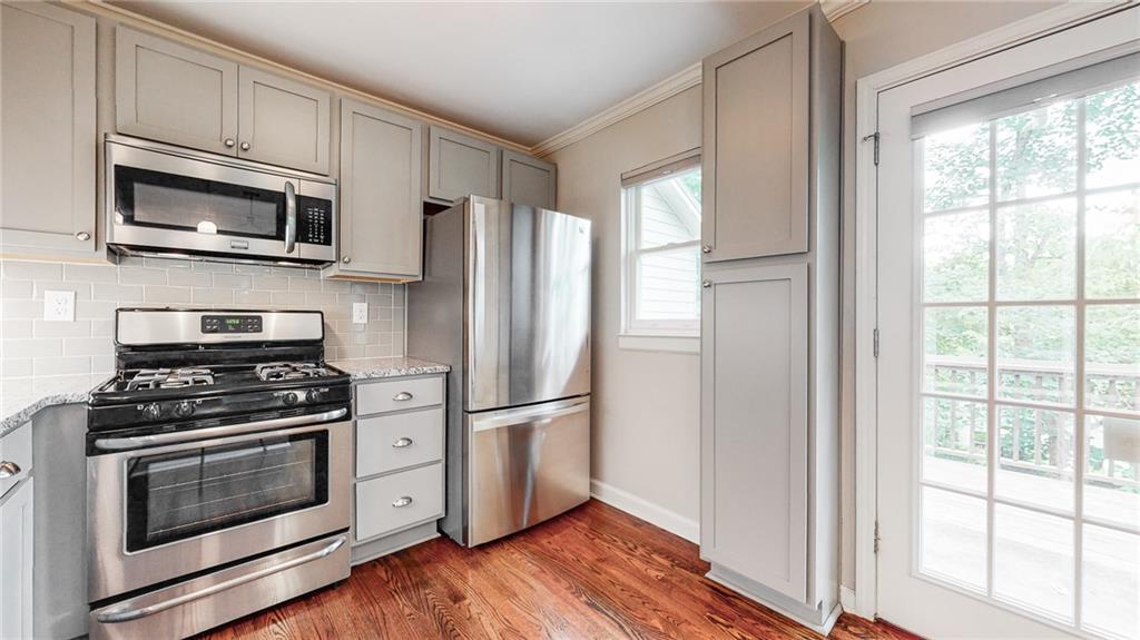 2305 Vistamont Drive Decatur, GA 30033 - Photo 12 of 28 a kitchen with a stove microwave and refrigerator
